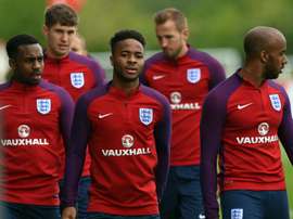 England's Danny Rose (L), John Stones (2nd L), Raheem Sterling (C), Harry Kane (2nd R) and Fabian Delph (R) take part in a training session at St George's Park