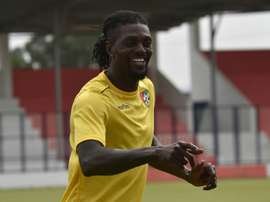 Emmanuel Adebayor (L) is pictured during a training session on January 18. AFP