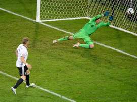Germanys midfielder Bastian Schweinsteiger scores a goal during the Euro 2016 group C football match between Germany and Ukraine at the Stade Pierre Mauroy in Villeneuve-dAscq near Lille on June 12, 2016