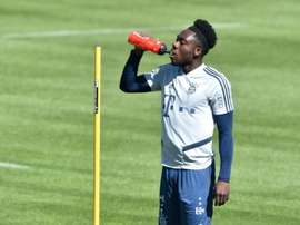 Bayern star, ex-refugee Davies raises funds for those forced to flee. AFP