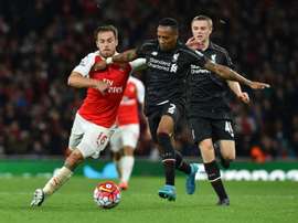 Arsenals Aaron Ramsey (L) fights for the ball with Liverpools Nathaniel Clyne during their English Premier League match, at the Emirates stadium in north London, on August 24, 2015