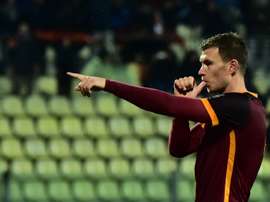 Romas forward Edin Dzeko celebrates after scoring a goal during the Serie A football match between Carpi and AS Roma at Alberto Braglia Stadium in Modena on February 12, 2016