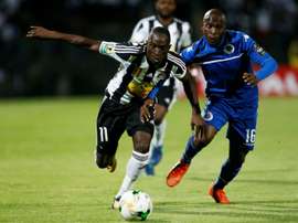 SuperSport United's Aubrey Bodiba and TP Mazembes' Adam Traore challenge for the ball. AFP