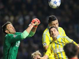 Galatasarays goalkeeper Fernando Muslera (L) fights for the ball with Astanas Marin Anicic and Astanas Roger Henao Canas during the UEFA Champions League group C football match at the Astana Arena stadium in Astana on September 30, 2015