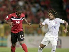 US Jermaine Jones (R) challenges Trinidad & Tobagos Andre Boucaud during the FIFA WC Russia 2018 CONCACAF football qualifier in Port of Spain, on November 17, 2015