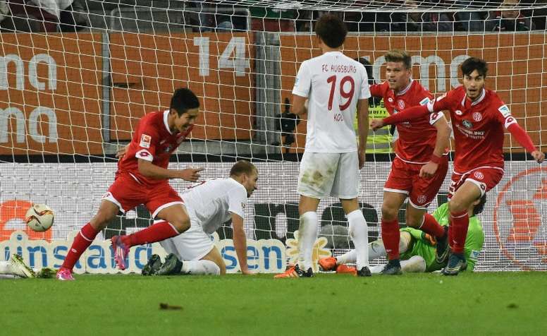Mainz Japanese striker Yoshinori Muto (L) celebrates scoring during the German first division Bundesliga football match FC Augsburg vs FSV Mainz in Augsburg, southern Germany, on October 31, 2015