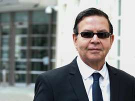 Former Honduran president Rafael Callejas leaves the Brooklyn federal court in New York, March 28, 2016 after pleading guilty to charges of racketeering conspiracy and wire fraud conspiracy in connection with the FIFA corruption scandal