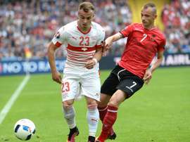 Albanias defender Ansi Agolli (right) challenges Switzerlands midfielder Xherdan Shaqiri during their Euro 2016 match at the Bollaert-Delelis Stadium in Lens on June 11, 2016