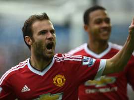 Manchester Uniteds Juan Mata (L) celebrates after scoring during the Premier League match against Swansea City at The Liberty Stadium in Swansea on August 30, 2015