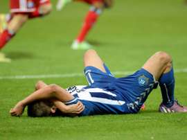 Dimitrij Nazarov hugged manager after nearly getting seriously injured on way to the game. AFP