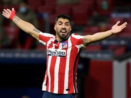 Suarez strikes again as Atletico march on with Valencia win. AFP