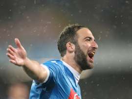 Napolis forward Gonzalo Higuain celebrates after scoring his 36th goal in the season during the Italian Serie A football match SSC Napoli vs Frosinone Calcio on May 14, 2016 at the San Paolo stadium in Naples