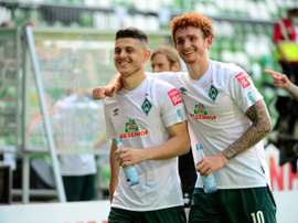 Rashica (L) is wanted by Dortmund. AFP