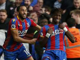 Townsend and Zaha celebrate scoring against West Ham United. AFP