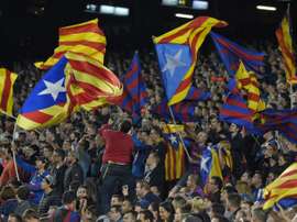 Barcelona supporters wave Catalan independece flags during the Spanish league match against SD Eibar at the Camp Nou stadium in Barcelona on October 25, 2015