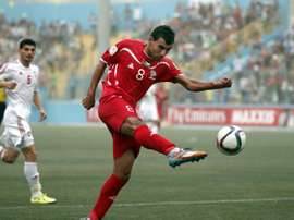 Palestinian forward Sameh Maraaba (C) kicks the ball during his 2018 FIFA World Cup qualifying football match against UAE at the Faisal al-Husseini Stadium, on September 8, 2015, in the West Bank town of Al-Ram