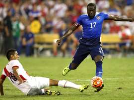 Jozy Altidore of the United States takes the ball past Carlos Lobaton of Peru in the second half during an international friendly at RFK Stadium on September 4, 2015 in Washington, DC
