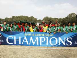 Bangladeshi U-14 girls football players celebrate after winning the AFC regional championship against Nepal in Kathmandu on December 20, 2015