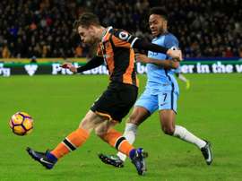 Hull City defender Andrew Robertson (L) vies with Manchester City midfielder Raheem Sterling during the English Premier League football match between Hull City and Manchester City at the KCOM Stadium on December 26, 2016