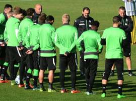 Moenchengladbachs head coach Andre Schubert (6L) speaks during a team training session on the eve of the Group D, first-leg UEFA Champions League football match against Manchester City FC in Moenchengladbach, Germany on September 29, 2015