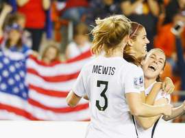 Alex Morgan of the US (C) celebrates with teammates after scoring a goal during their CONCACAF Womens Olympic Qualifying semi-final against Trinidad and Tobago, at BBVA Compass Stadium in Houston, Texas, on February 19, 2016
