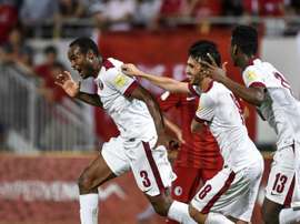 Qatars Abdelkarim Hassan (L) celebrates after scoring a goal during the 2018 World Cup football qualifying match between Qatar and Hong Kong in Hong Kong on September 8, 2015