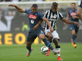 Napolis Algerian defender Faouzi Ghoulam tackles Juventus French midfielder Kingsley Coman in an Italian league match on May 23, 2015 in Turin