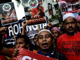 Rohingya Muslim refugees protest against the persecution of Rohingya Muslims in Myanmar, outside the Myanmar Embassy in Kuala Lumpur on November 25, 2016