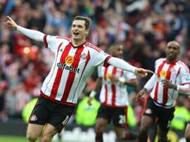 Sunderlands English midfielder Adam Johnson celebrates scoring the opening goal from the penalty spot during an English Premier League football match against Newcastle United in Sunderland, northeast England, on October 25, 2015