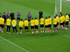 Sevillas players listen to coach Unai Emery during a training session on the eve of the Champions League football match Juventus vs Sevilla FC at the Juventus Stadium on September 29, 2015 in Turin