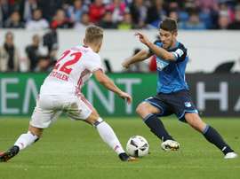 Hoffenheim's Sandro Wagner and Hamburg's Matthias Ostrzolek (L) fight for the ball. AFP