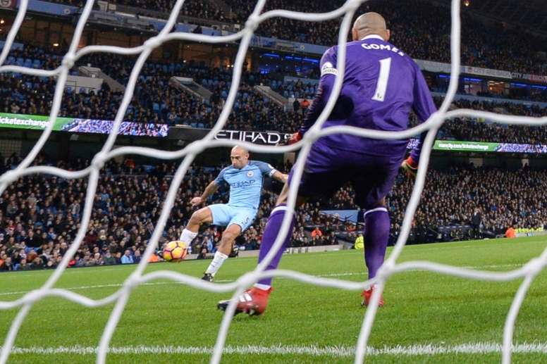 Manchester Citys Pablo Zabaleta (L) scores his teams opening goal against Watford at the Etihad Stadium in Manchester, north west England, on December 14, 2016