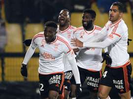 Benjamin Moukandjo celebrates with his Lorient teamamtes after scoring a goal during in Ligue 1. AFP
