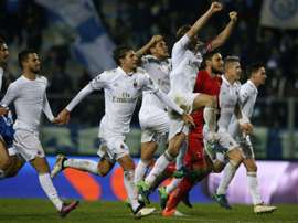 AC Milans players celebrate at the end of the Italian Serie A football match between Empoli and AC Milan on November 26, 2016