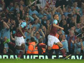 West Ham Uniteds defender Winston Reid (R) celebrates after scoring the winning goal during the English Premier League football match between West Ham United and Manchester United in Upton Park, in east London on May 10, 2016