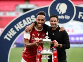 Mikel Arteta thinks Aubameyang (L) will stay at Arsenal. AFP