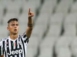 Juventus Argentinian forward Paulo Dybala celebrates after scoring during the Italian Serie A football match between Juventus and Chievo on September 12, 2015 at the Juventus Stadium in Turin