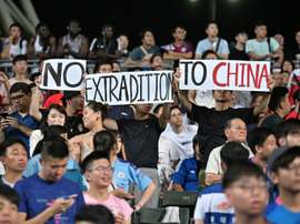 Hong Kong demonstrators unfurled banners and sang a protest song during the match. AFP