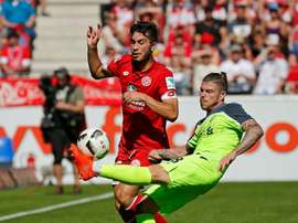 Mainz midfielder Suat Serdar (L) and Liverpools defender Alberto Moreno fight for the ball in Mainz, central Germany, on August 7, 2016