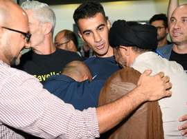 Refugee footballer makes triumphant return to Australia