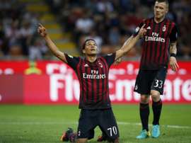 AC Milans forward Carlos Bacca from Colombia (L) celebrates after scoring on October 2, 2016