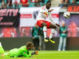 Jean-Kevin Augustin (R) was caught using his phone before a Europa league match. AFP