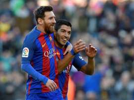 Luis Suarez et Lionel Messi fêtent un but face à Las Palmas en Liga. AFP