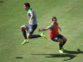 A superb solo strike from Socceroos star Tom Rogic, pictured (L) in a file photo, his first at Celtic Park, put the home side in front in the 45th minute in a crucial 3-1 win over St Johnstone