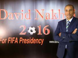 Former Trinidad and Tobagos football player David Nakhid in front of a poster during a press conference to launch his bid to succeed FIFA president Sepp Blatter on September 28, 2015 in the Lebanese capital Beirut