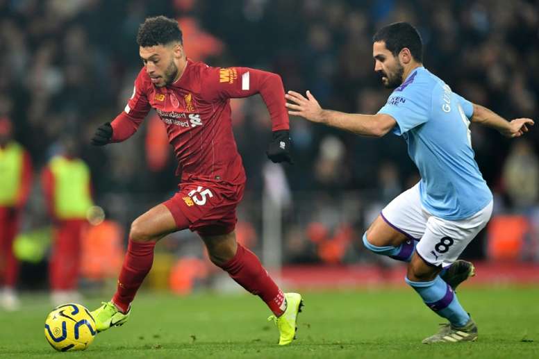 Gundogan (R) says he would not mind taking a pay cut if asked. AFP