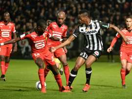 Angers forward Sliman Sissoko (R) vies with Rennes defender Fallou Diagne (L) and midfielder Gelson Fernandes (C) during the French L1 football match on November 6, 2015 at the Jean Bouin stadium, in Angers, western France