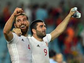 Georgias defender Guram Kashia (L) and midfielder Jano Ananidze celebrate their 1-0 victory at the end of the Euro 2016 friendly vs Spain in Getafe, on June 7, 2016