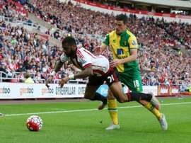 Norwich Citys Scottish midfielder Graham Dorrans (R) tackles Sunderlands French midfielder Yann MVila during the English Premier League football match at the Stadium of Light in Sunderland, north east England on August 15, 2015