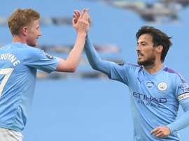 Kevin de Bruyne (L) says David Silva's (R) departure will be a big loss for Man City. AFP